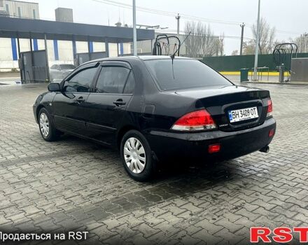 Чорний Міцубісі Lancer, об'ємом двигуна 1.6 л та пробігом 248 тис. км за 3950 $, фото 2 на Automoto.ua