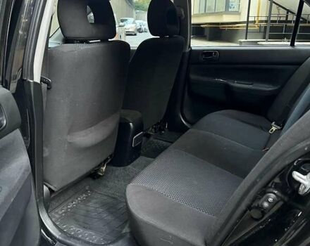 Чорний Міцубісі Lancer, об'ємом двигуна 1.58 л та пробігом 135 тис. км за 4100 $, фото 1 на Automoto.ua