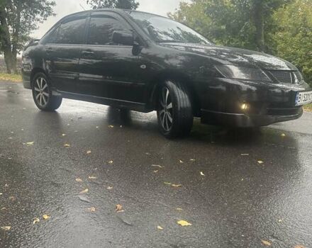 Чорний Міцубісі Lancer, об'ємом двигуна 1.6 л та пробігом 310 тис. км за 5100 $, фото 28 на Automoto.ua