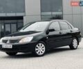 Чорний Міцубісі Lancer, об'ємом двигуна 1.6 л та пробігом 243 тис. км за 4950 $, фото 1 на Automoto.ua