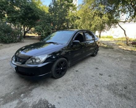 Черный Мицубиси Лансер, объемом двигателя 2 л и пробегом 240 тыс. км за 5600 $, фото 5 на Automoto.ua