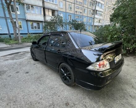 Черный Мицубиси Лансер, объемом двигателя 2 л и пробегом 240 тыс. км за 5600 $, фото 4 на Automoto.ua