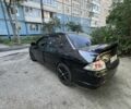Черный Мицубиси Лансер, объемом двигателя 2 л и пробегом 240 тыс. км за 5600 $, фото 4 на Automoto.ua