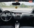 Чорний Міцубісі Lancer, об'ємом двигуна 1.6 л та пробігом 243 тис. км за 4950 $, фото 47 на Automoto.ua