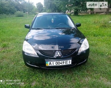 Чорний Міцубісі Lancer, об'ємом двигуна 1.58 л та пробігом 400 тис. км за 3700 $, фото 14 на Automoto.ua