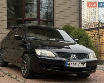 Черный Мицубиси Лансер, объемом двигателя 1.6 л и пробегом 211 тыс. км за 5700 $, фото 38 на Automoto.ua