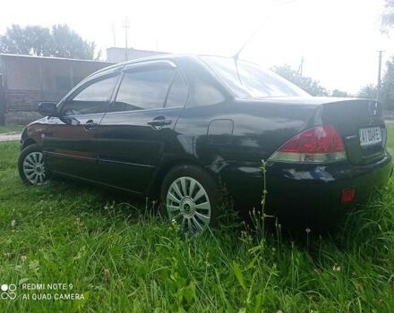 Чорний Міцубісі Lancer, об'ємом двигуна 1.58 л та пробігом 400 тис. км за 3700 $, фото 35 на Automoto.ua