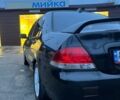 Черный Мицубиси Лансер, объемом двигателя 1.6 л и пробегом 249 тыс. км за 5000 $, фото 8 на Automoto.ua