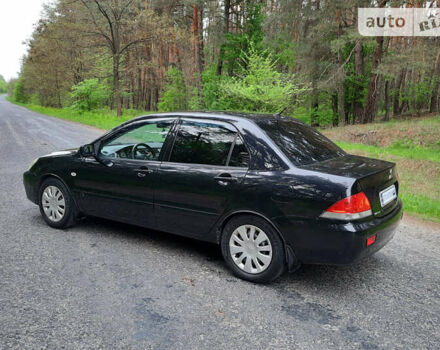 Чорний Міцубісі Lancer, об'ємом двигуна 1.6 л та пробігом 222 тис. км за 4850 $, фото 3 на Automoto.ua