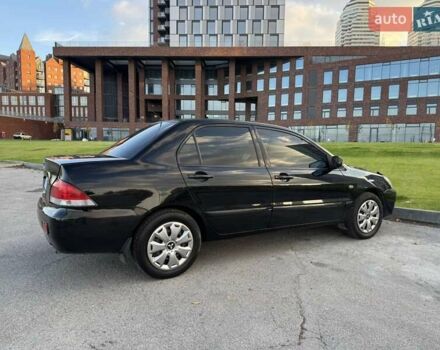 Черный Мицубиси Лансер, объемом двигателя 1.58 л и пробегом 237 тыс. км за 3999 $, фото 14 на Automoto.ua