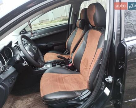 Черный Мицубиси Лансер, объемом двигателя 2 л и пробегом 195 тыс. км за 7899 $, фото 9 на Automoto.ua