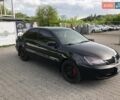 Чорний Міцубісі Lancer, об'ємом двигуна 1.59 л та пробігом 179 тис. км за 4980 $, фото 1 на Automoto.ua