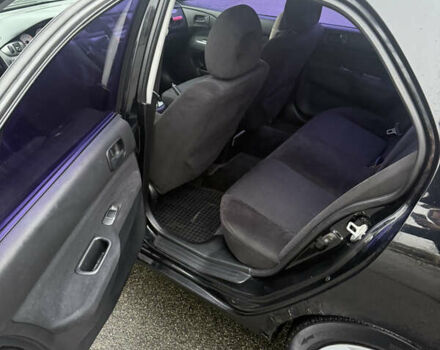 Чорний Міцубісі Lancer, об'ємом двигуна 1.58 л та пробігом 256 тис. км за 3700 $, фото 17 на Automoto.ua