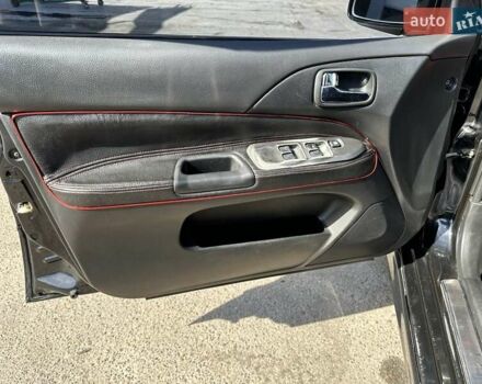 Черный Мицубиси Лансер, объемом двигателя 2 л и пробегом 272 тыс. км за 5514 $, фото 14 на Automoto.ua