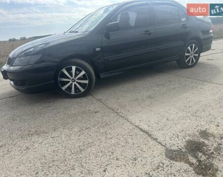 Чорний Міцубісі Lancer, об'ємом двигуна 1.6 л та пробігом 310 тис. км за 5100 $, фото 21 на Automoto.ua