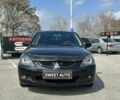 Чорний Міцубісі Lancer, об'ємом двигуна 1.6 л та пробігом 226 тис. км за 3899 $, фото 1 на Automoto.ua