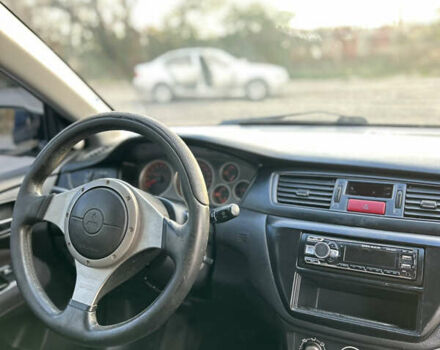 Чорний Міцубісі Lancer, об'ємом двигуна 2 л та пробігом 280 тис. км за 4600 $, фото 36 на Automoto.ua