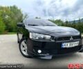 Черный Мицубиси Лансер, объемом двигателя 2 л и пробегом 230 тыс. км за 7000 $, фото 1 на Automoto.ua