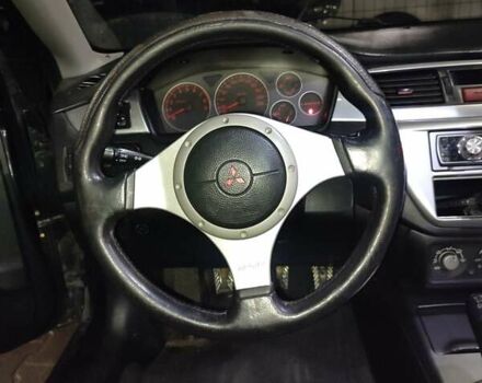 Чорний Міцубісі Lancer, об'ємом двигуна 2 л та пробігом 145 тис. км за 5000 $, фото 4 на Automoto.ua