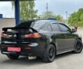 Черный Мицубиси Лансер, объемом двигателя 2 л и пробегом 192 тыс. км за 6799 $, фото 1 на Automoto.ua