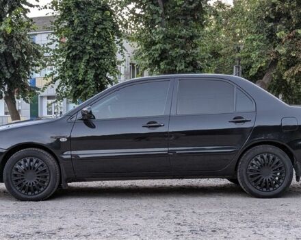 Черный Мицубиси Лансер, объемом двигателя 1.6 л и пробегом 226 тыс. км за 4800 $, фото 13 на Automoto.ua