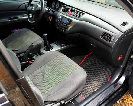 Черный Мицубиси Лансер, объемом двигателя 1.6 л и пробегом 171 тыс. км за 4350 $, фото 8 на Automoto.ua