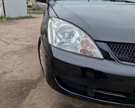 Чорний Міцубісі Lancer, об'ємом двигуна 1.6 л та пробігом 273 тис. км за 3999 $, фото 10 на Automoto.ua