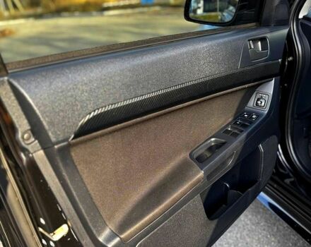 Черный Мицубиси Лансер, объемом двигателя 2 л и пробегом 224 тыс. км за 7000 $, фото 5 на Automoto.ua