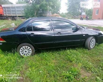 Чорний Міцубісі Lancer, об'ємом двигуна 1.58 л та пробігом 400 тис. км за 3700 $, фото 17 на Automoto.ua