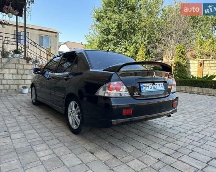 Черный Мицубиси Лансер, объемом двигателя 2 л и пробегом 272 тыс. км за 5514 $, фото 3 на Automoto.ua