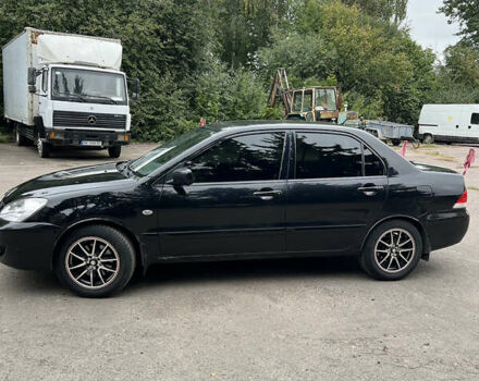 Чорний Міцубісі Lancer, об'ємом двигуна 1.58 л та пробігом 256 тис. км за 4200 $, фото 3 на Automoto.ua