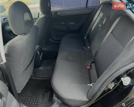 Чорний Міцубісі Lancer, об'ємом двигуна 1.58 л та пробігом 185 тис. км за 3750 $, фото 13 на Automoto.ua