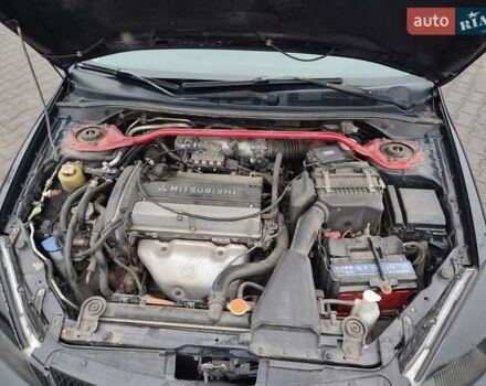 Чорний Міцубісі Lancer, об'ємом двигуна 2 л та пробігом 145 тис. км за 5000 $, фото 12 на Automoto.ua