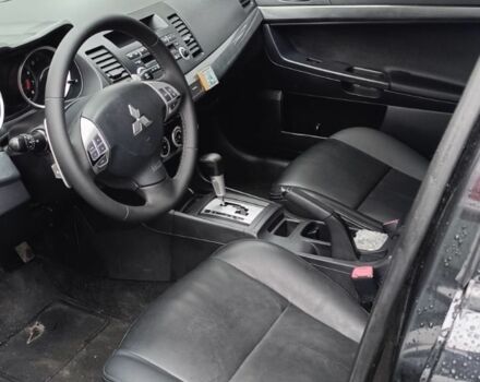 Черный Мицубиси Лансер, объемом двигателя 2 л и пробегом 210 тыс. км за 6000 $, фото 9 на Automoto.ua