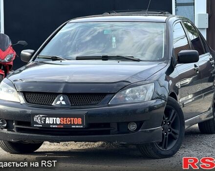 Черный Мицубиси Лансер, объемом двигателя 1.6 л и пробегом 260 тыс. км за 3700 $, фото 1 на Automoto.ua