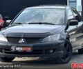 Черный Мицубиси Лансер, объемом двигателя 1.6 л и пробегом 260 тыс. км за 3700 $, фото 1 на Automoto.ua