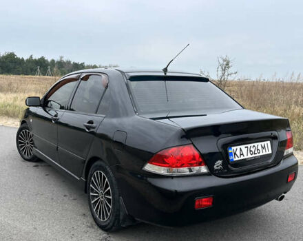 Чорний Міцубісі Lancer, об'ємом двигуна 1.6 л та пробігом 212 тис. км за 4700 $, фото 3 на Automoto.ua