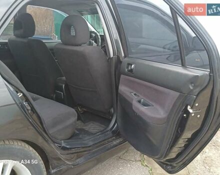 Черный Мицубиси Лансер, объемом двигателя 2 л и пробегом 286 тыс. км за 4000 $, фото 13 на Automoto.ua