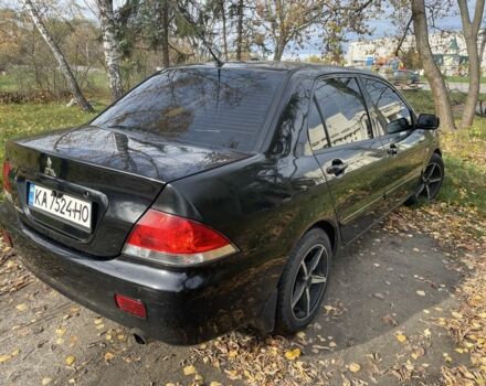 Міцубісі Lancer 2007 у Каневе на Automoto.ua Чорний Міцубісі Lancer, об'ємом двигуна 1.6 л та пробігом 310 тис. км за 4100 $, фото 2 на Automoto.ua