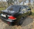 Міцубісі Lancer 2007 у Каневе на Automoto.ua Чорний Міцубісі Lancer, об'ємом двигуна 1.6 л та пробігом 310 тис. км за 4100 $, фото 2 на Automoto.ua