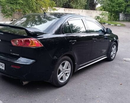 Черный Мицубиси Лансер, объемом двигателя 2 л и пробегом 210 тыс. км за 6000 $, фото 5 на Automoto.ua