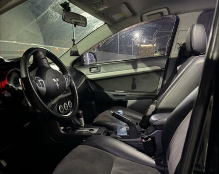 Черный Мицубиси Лансер, объемом двигателя 2 л и пробегом 320 тыс. км за 5300 $, фото 7 на Automoto.ua