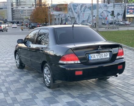 Черный Мицубиси Лансер, объемом двигателя 1.6 л и пробегом 237 тыс. км за 4300 $, фото 3 на Automoto.ua