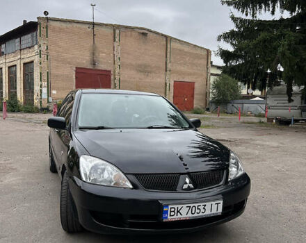 Чорний Міцубісі Lancer, об'ємом двигуна 1.58 л та пробігом 256 тис. км за 4200 $, фото 1 на Automoto.ua
