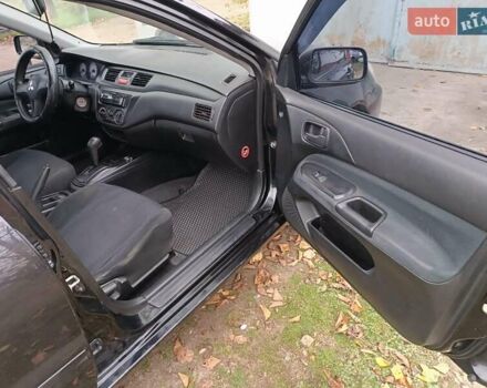Чорний Міцубісі Lancer, об'ємом двигуна 1.58 л та пробігом 227 тис. км за 4100 $, фото 12 на Automoto.ua