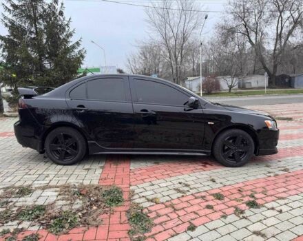 Черный Мицубиси Лансер, объемом двигателя 2 л и пробегом 217 тыс. км за 5500 $, фото 4 на Automoto.ua