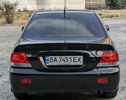 Черный Мицубиси Лансер, объемом двигателя 1.6 л и пробегом 226 тыс. км за 4800 $, фото 6 на Automoto.ua