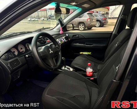 Чорний Міцубісі Lancer, об'ємом двигуна 1.6 л та пробігом 220 тис. км за 4200 $, фото 6 на Automoto.ua