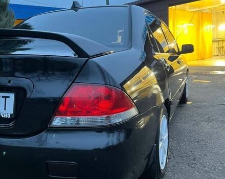 Черный Мицубиси Лансер, объемом двигателя 1.6 л и пробегом 249 тыс. км за 5000 $, фото 9 на Automoto.ua