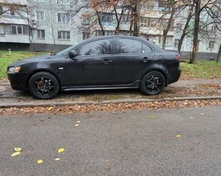 Черный Мицубиси Лансер, объемом двигателя 2 л и пробегом 260 тыс. км за 5500 $, фото 1 на Automoto.ua